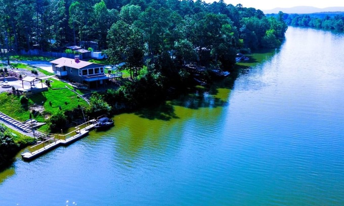 Cave Spring House | Escape to Tranquil Waters, where comfort meets calm. Enjoy serene river views and waterfront access, inviting spaces, and the perfect backdrop for rest, romance, or family fun. Boat Rental and Fishing Charters available anytime of the year.