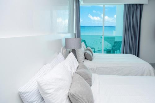 Zona Hotelera Apartment | Exclusive studio on the beach, minimalist, gym, pool, jacuzzi, balcony