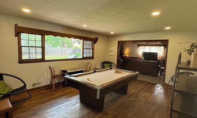 Wichita House | Experience Wichita living near WSU! Fire Pit, Pool Table, and Arcade games.