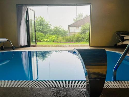 Marupe House | Family apartment with pool & garden view