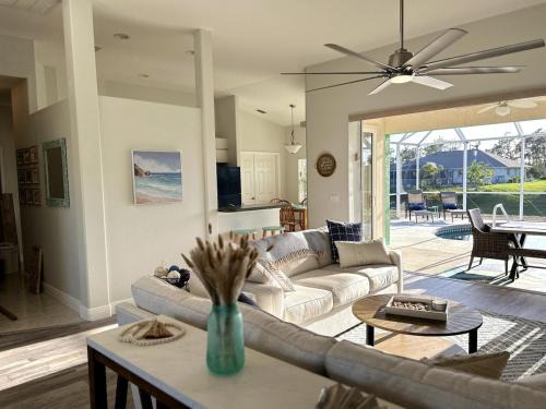 Pinehurst House | Family Friendly 3BR with Sunset Views Heated Pool Canal Front near Beach