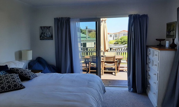 Waitarere Beach House | Family friendly, fully fenced bach, close to the beach, shops and playground.