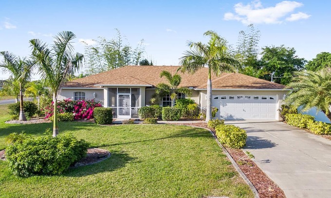 Biggar House | Fenced, private, family friendly villa with exotic poolside views near airport.
