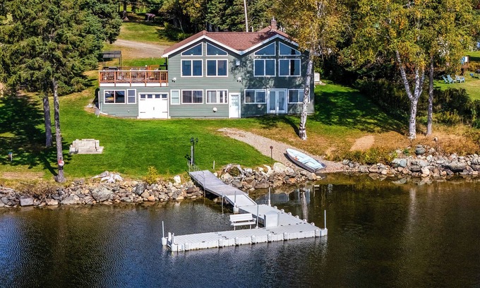 Rangeley House | Fielding Lakehouse - Spacious home with nice grass area leading to Rangeley Lake