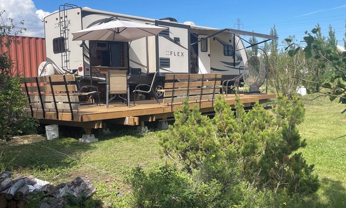 Leduc County House | Flex RV Travel trailer parked on a beautiful 4 acre lot, overseeing forest land.