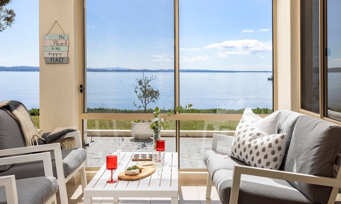 Salamander Bay House | Foreshore Delight offers a tranquil holiday retreat with breathtaking water views