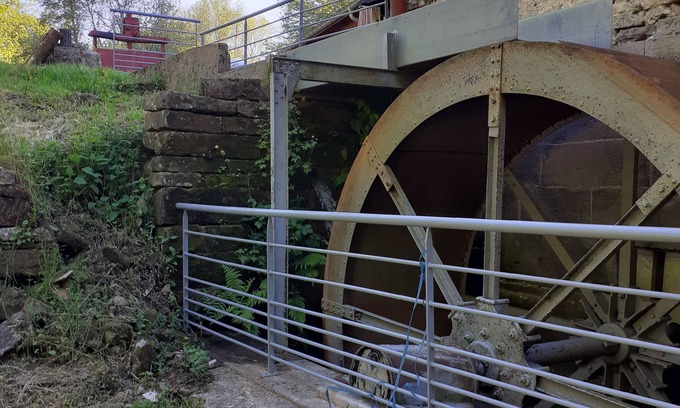 Escles House | Former flour mill with pond on wooded grounds