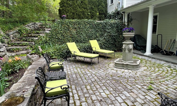 New Canaan House | Fountain Courtyard and Fireplace Kitchen