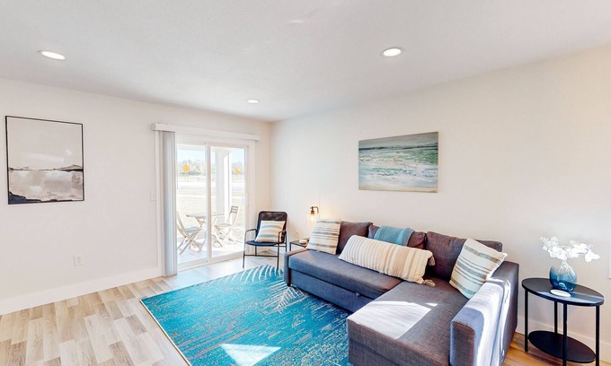 Bay Acres House | Full duplex near beach with renovated interior, screened porches-Dogs ok