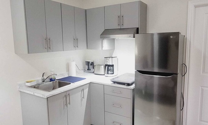 Kitchener House | Fully furnished Studio basement with bed, kitchen, laundry, living room with TV