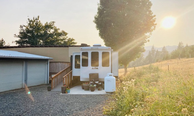 Ariel House | Glamping at Coyote Ridge! Camp out in style in a luxury cottage RV! W/firepit