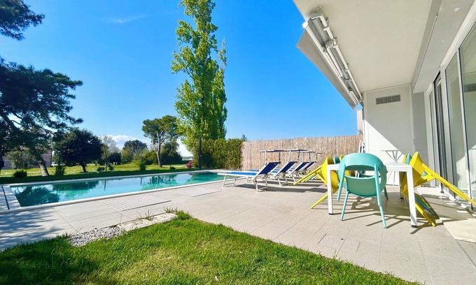 Isola Albarella Villa | Golden hour retreat lagoon view villa with pool