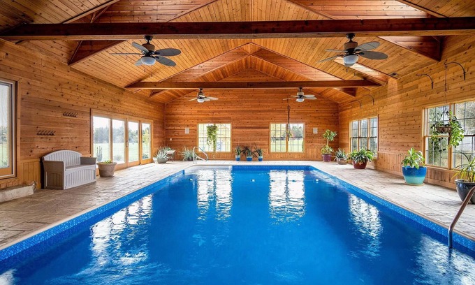Radnor House | Gorgeous Home featuring an Indoor Heated Pool, Gourmet Kitchen & Outdoor Spaces