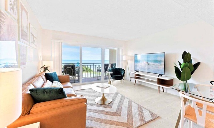 Satellite Beach Condo | Gorgeous Oceanside Oasis w/Heated Pool, Oceanfront Patio & Steps to the Beach 🏖️☀️