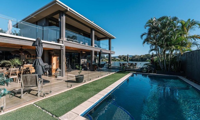 Oxenford House | Gorgeous Riverfront 5BR House with Pool