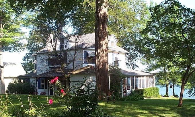 Paw Paw Lake House | Gorgeous Sandy Beachfront Paw Paw lake home with 155 ft. of frontage and dock