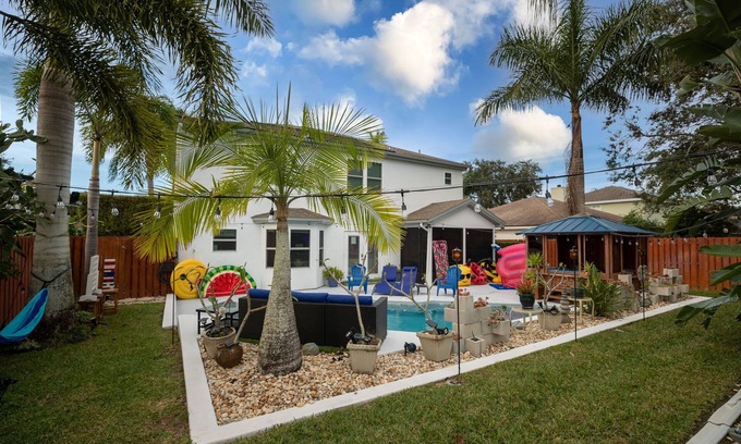 Tropic House | Gorgeous Urban Oasis w/Hot Tub, HEATED POOL and Private Movie Theater by RedAwning