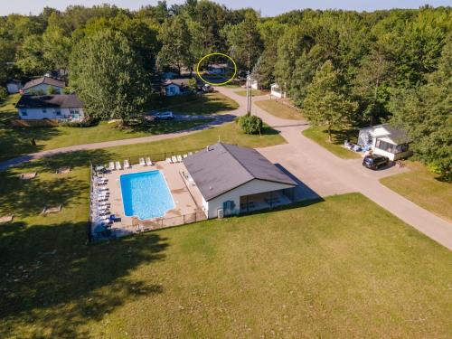Saugatuck House | Goshorn 18 - Located in Goshorn Lake Resort - Shared pool - Lake access
