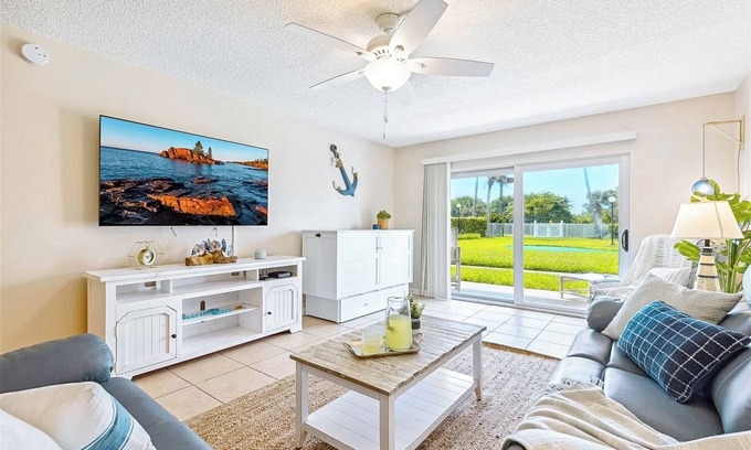 Port Canaveral Condo | Ground Floor Family Beach Escape – Pool, Patio & Walk to the Pier!