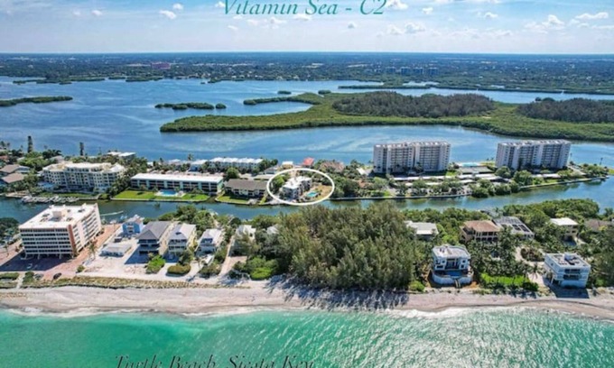 Siesta Key Condo | Gulf views! Quiet Canal Front Oasis-2 BR/1 bath-Htd pool with SUP+Kayak! n