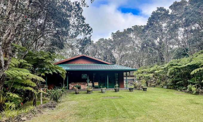 Volcano House | Hidden paradise with a hot tub, wood fireplace, large lanai, & jetted tub