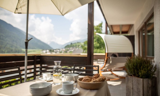 Santa Valburga Apartment | Holiday Apartment 'Pöder Goldlahn' with Mountain View, Balcony, Shared Garden & Wi-Fi