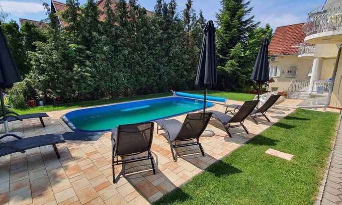Siofok Apartment | Holiday apartment with a covered terrace and children's playground