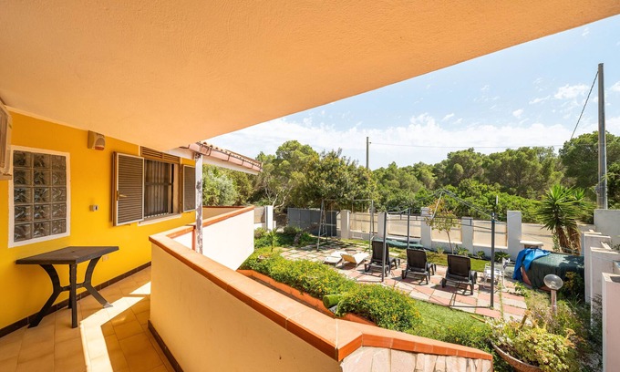 Porto Pino House | Holiday Home 'Villa Mimosa' with Private Terrace, Private Garden and Air Conditioning