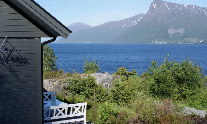 Hareid Cabin | Holiday home with view plot beyond Fjord and mountains.