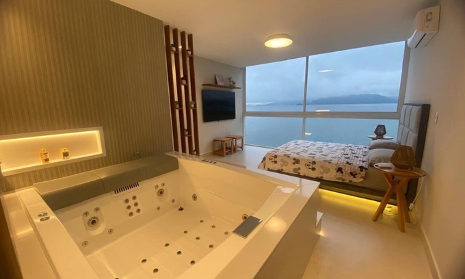 Mambucaba Apartment | Home Sweet Sea. Beachfront Retreat: Luxury, Comfort and Exclusive SPA