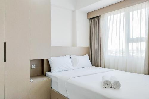 South Tangerang Apartment | Homey and Modern 2BR at Loftvilles City Apartment By Travelio