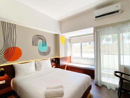 Duren Sawit Apartment | Homey Studio No Kitchen at Gateway Park LRT City Jatibening Apartment By Travelio