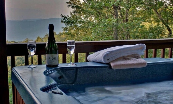 Chatsworth Cabin | Hummingbird Haven is the ultimate retreat for large groups! Enjoy pet-friendly accommodations, breathtaking mountain views, a hot tub, firepit, WiFi, and hiking
