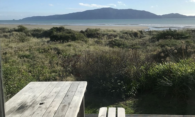 Waikanae House | Iconic absolute beachfront 60s bach