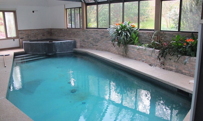 Chesapeake Beach House | Indoor pool and spa in contemporary French home secluded in surrounding woods