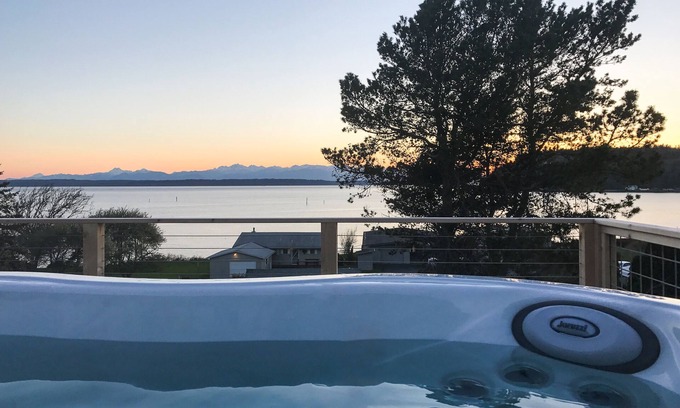 Clinton House | Inviting Puget Sound view home with beach access, fire table, hot tub, & W/D