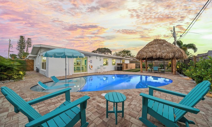 Surfside Estates House | Island Oasis with Heated Pool, Putt Putt Course, Tiki Bar, and Beach Gear!