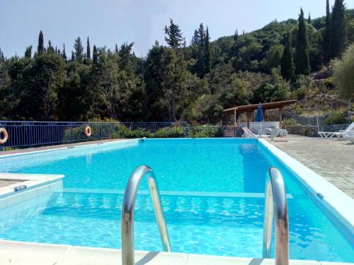 Matsoukata Apartment | KAMINAKIA Apartments-Adults only -Walk into a tranquil oasis where peace & quiet are woven into every breath -Nestled within a serene evergreen cypress forest, each Apartment opens wide to the endless sea and a sunbathed pool awaits to soothe your senses