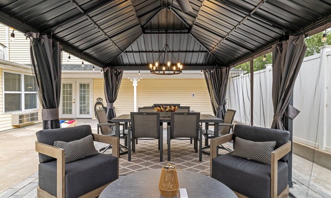 Kimmswick House | Kimmswick Porch Haven: Hot Tub, Cozy Fire Pit, & Fenced Yard!