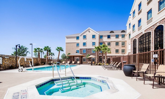 Biggs Field Apartment | King Studio | Free Breakfast Buffet. Pool & Hot Tub Access.