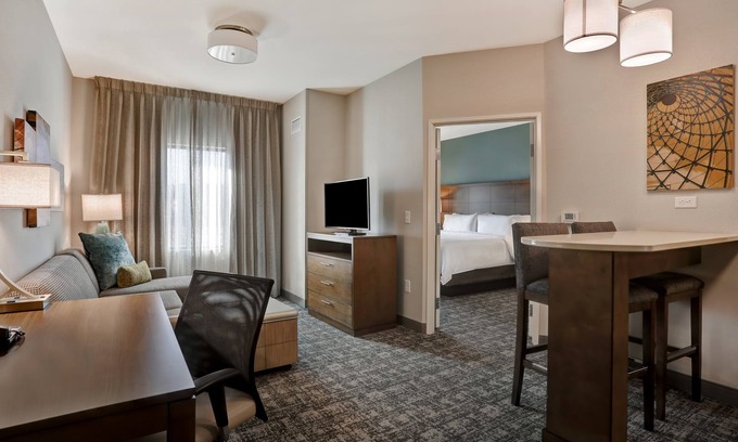 Overland Park Condo | King Suite. Free Breakfast. Pool. Shared BBQ.