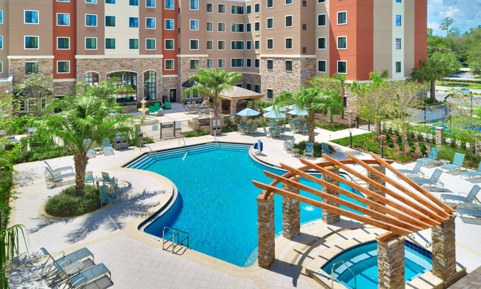 Gainesville Condo | King Suite. Outdoor Pool & Hot Tub. Free Breakfast. 10 Minutes to University of Florida.