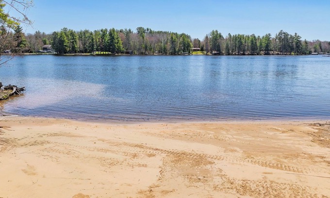 Eagle River Condo | Lake Forest Resort – Relax on a Pristine Sandy Beach in the Northwoods!
