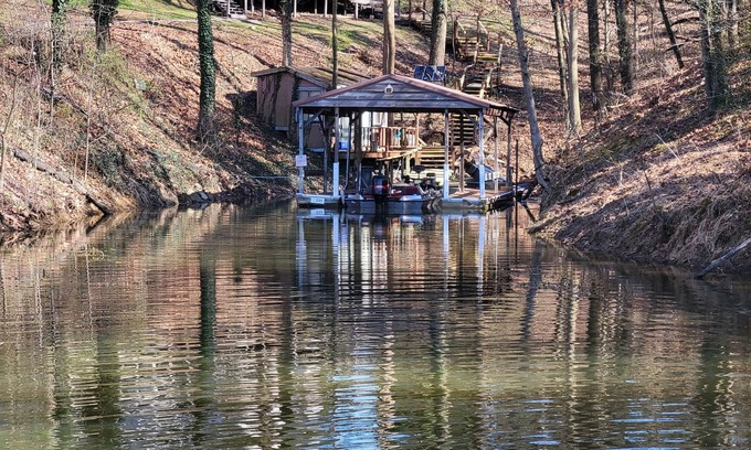 Wolf Creek House | Lake Front. Large shaded deck with Covered Dock access. Fire pit.
