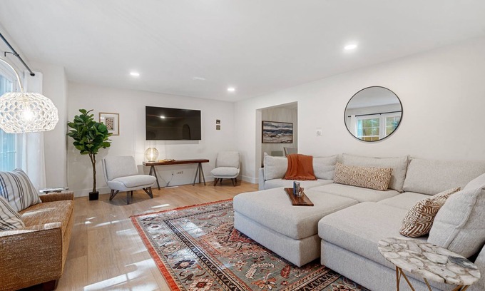 Norton Shores House | Lake MI Nest- perfect for group trips with access to Lake MI & private hot tub!