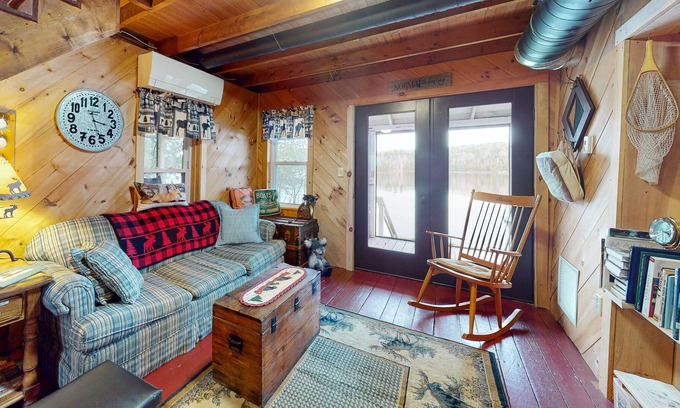 Oquossoc Cabin | Lakefront cabin with screened porch, woodstove, & water access - dog-friendly