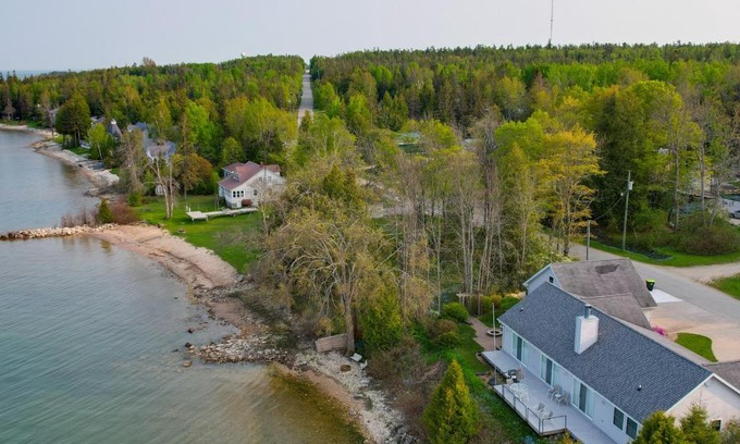De Tour Village House | Lakefront De Tour Village Home with Deck and Fire Pit!