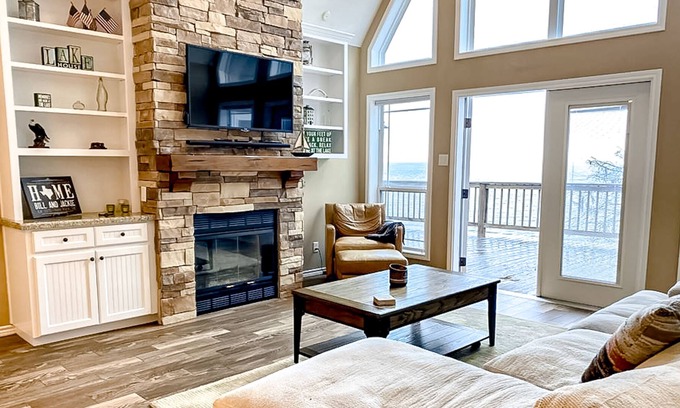 Pointblank House | Lakefront dog-friendly home with alfresco dining, balcony, & fireplace
