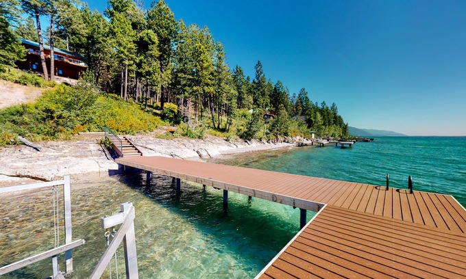 Woods Bay Cabin | Lakefront getaway with dock, 400- square-foot deck, close to town