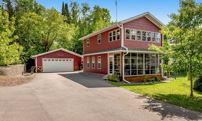 Arbor Vitae House | Lakefront home with dock, fireplace, deck, firepits & fast WiFi - dog-friendly